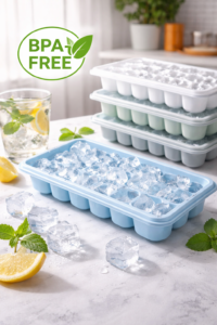BPA-free plastic ice trays with clear ice cubes on a kitchen counter